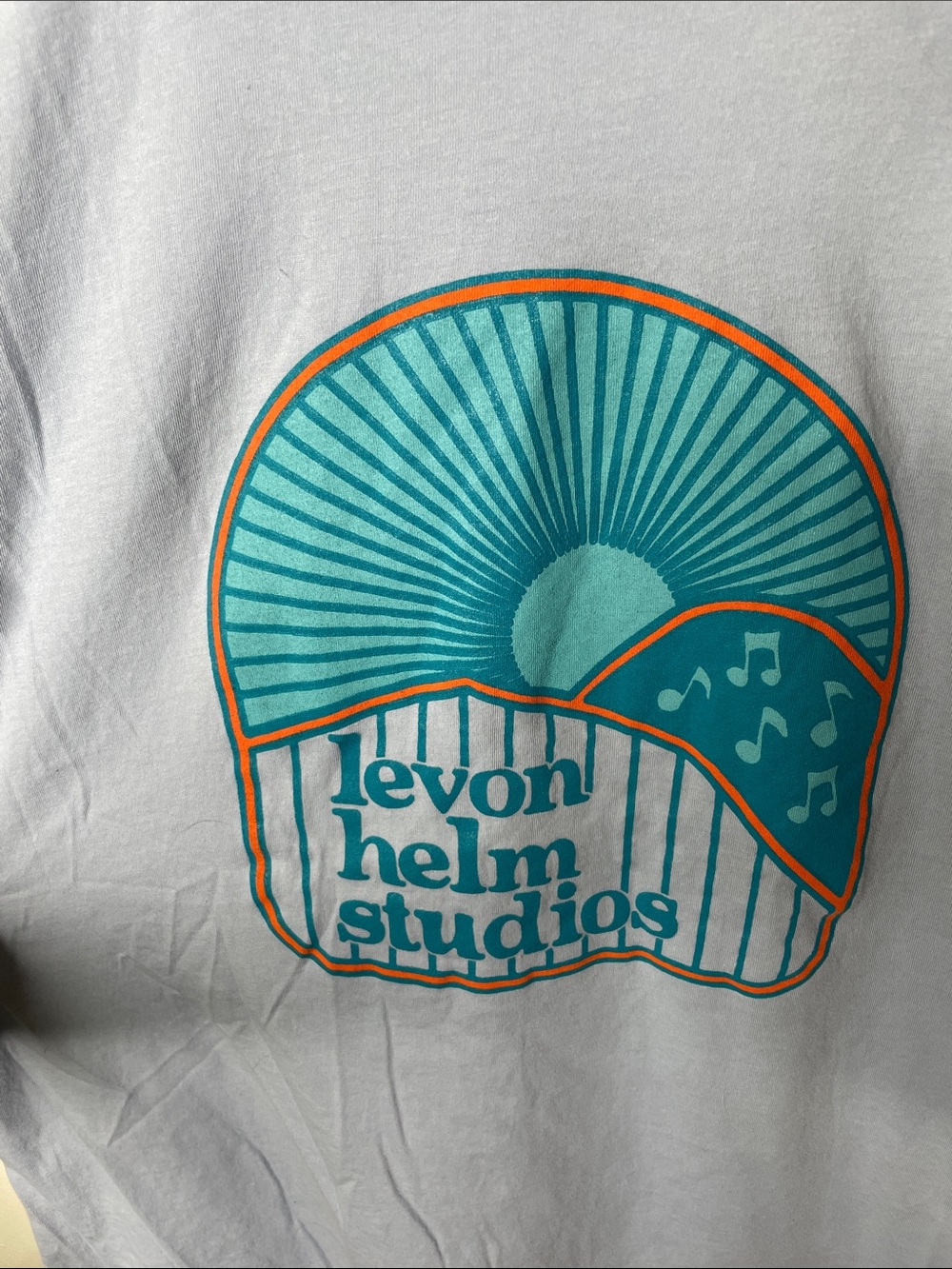 Levon Helm Stuios Woodstock NY Light Blue Graphic Tee with Teal & Orange Design